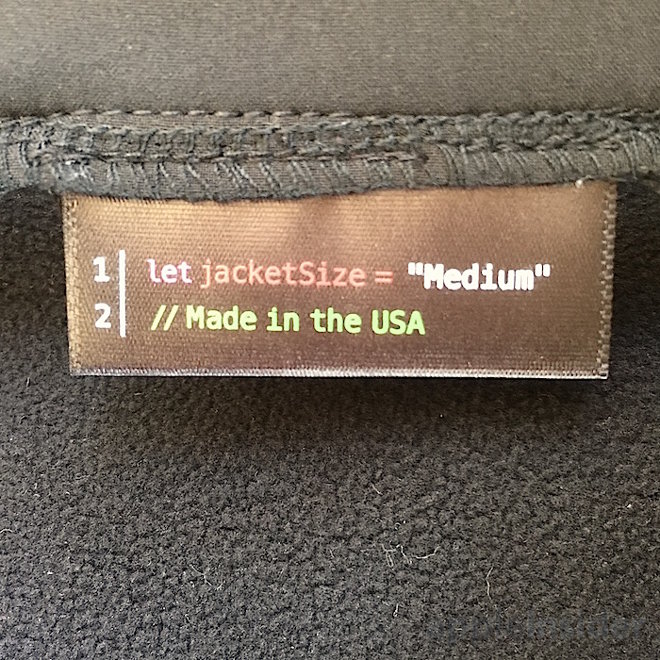 photo of WWDC attendees greeted with jackets featuring Apple Watch San Francisco font, Swift code image