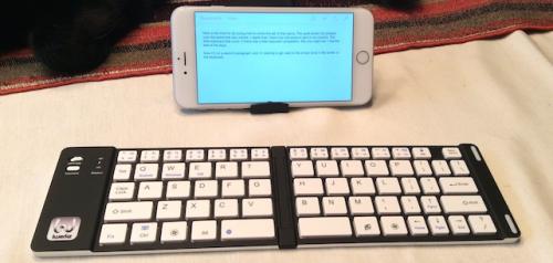 photo of iPhone 6 Plus + cheap folding Bluetooth keyboard = little laptop image