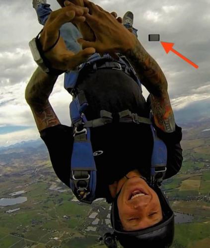 photo of Hilarious Picture Captures the Exact Moment a Skydiver Loses iPhone in Middle of Free Fall image