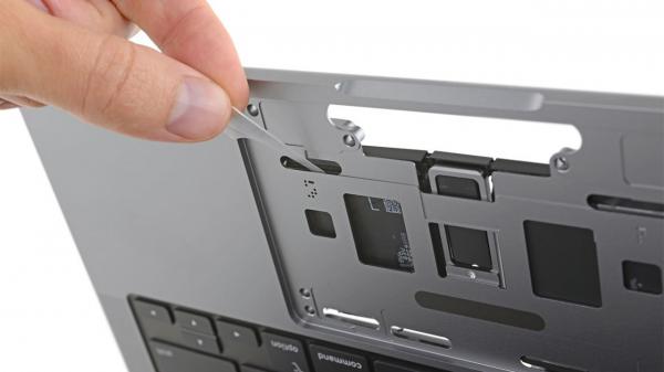 photo of New MacBook Pro uses battery pull tabs for easy replacement image