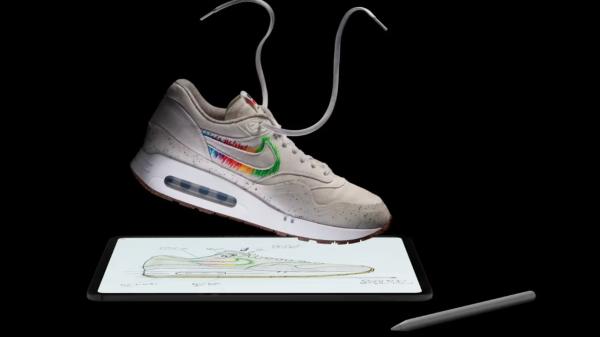 photo of Tim Cook sports Nike sneakers custom made for the iPad launch image
