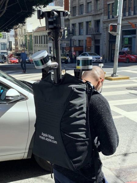 photo of Man Wearing Apple Maps Backpack Surveying San Francisco on Foot image