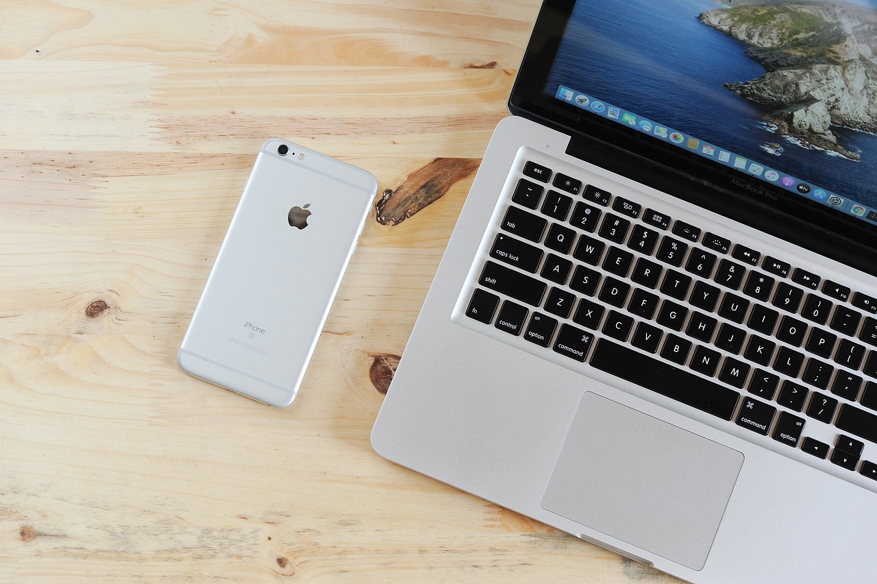 Apple MacBook and iPhone on desk