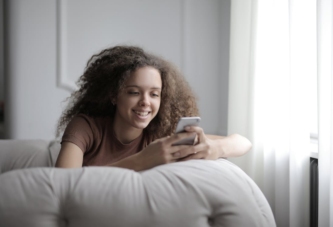 young woman using iPhone