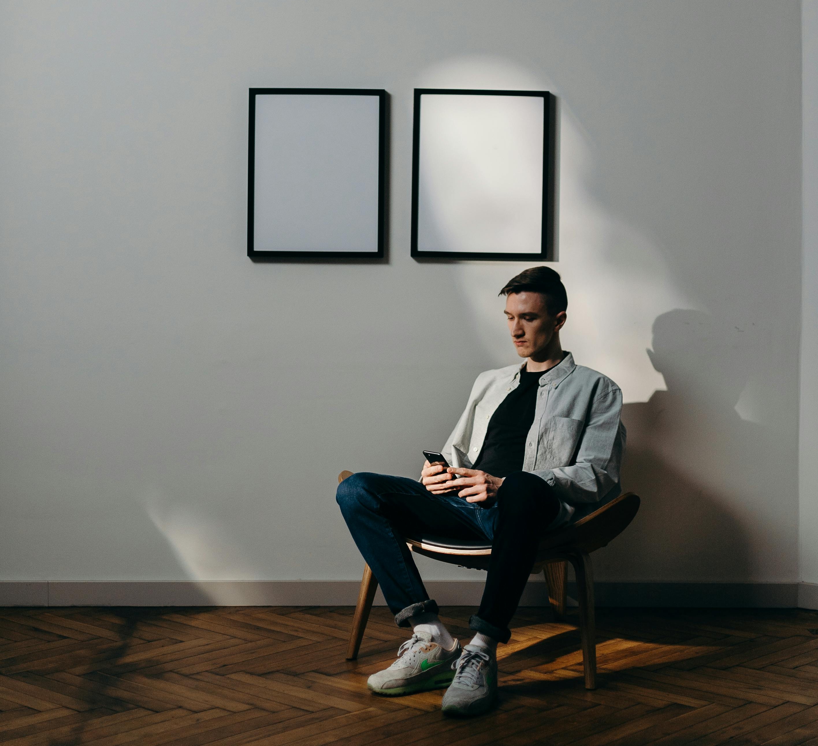 person sitting using iPhone